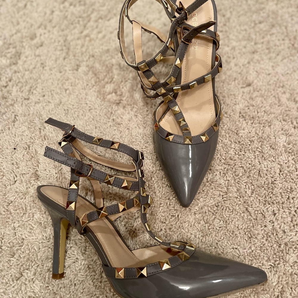 Gray leather heels with gold accents